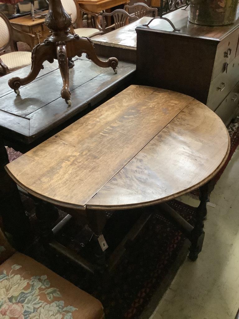 An 18th century oak gateleg table, width 116cm, depth 118cm, height 74cm